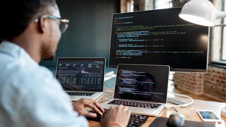 A website designer developing a small-business website on a computer